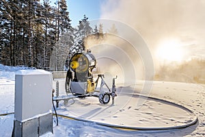 Snow cannon napisy snow on the ski piste at sunset