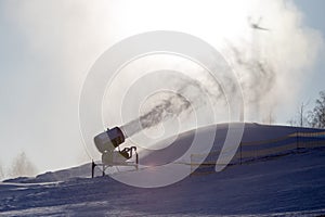 Snow cannon in a ski resort in winter