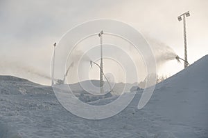 Snow cannon in ski slope