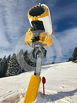 Snow cannon on skiing piste