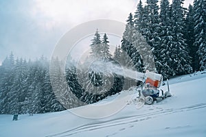 Snow cannon in winter mountains
