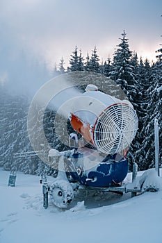 Snow cannon in winter mountains