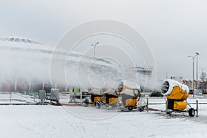 Snow cannons spray artificial snow crystals. Production of artificial snow. Cars make snow. Snow guns