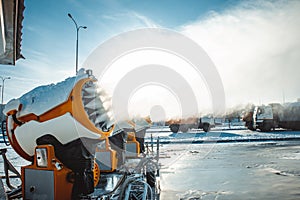 Snow cannons spray artificial snow crystals. Production of artificial snow. Cars make snow. Snow guns