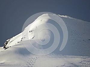 Snow-capped alpine peak Schofwisspitz 1989 m in Alpstein mountain range and in Appenzell Alps massif, Unterwasser