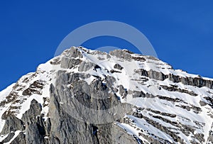 Snow-capped alpine peak Stoss or Stooss, 2112 m in Alpstein mountain range and in Appenzell Alps massif, Alt St. Johann