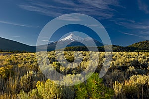 Snow capped Mount Shasta Volcano towering high