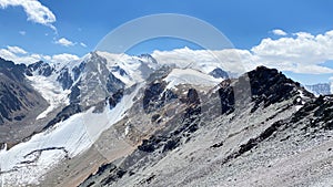 Snow-capped mountain peaks. Beautiful mountain summer landscape. Amazing mountain view around Komsomolets Peak, Ala-Archa National