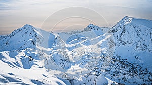 Snow capped mountain peaks of mountain range in Pyrenees Mountains, Andorra