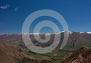 Snow capped mountain peaks seen from the Roy's Peak in New Zealand