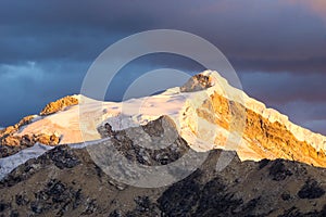 Snow capped mountain at sunset in the Andes in Peru photo