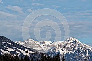 Snow-capped mountains against blue sky