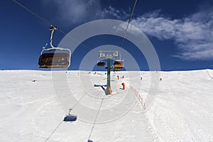 Snow-capped mountains. Alps, winter landscape. Ski resort. Chair lift. Bellamonte, Lusia, Valbona, Dolomites, Italy, Trentino. Win