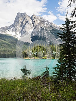 Snow capped mountains and clear lake