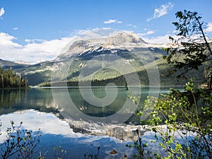 Snow capped mountains and clear lake