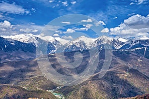Snow-capped mountains, extreme sports. Cloudy sky. photo