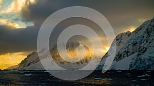 Snow Capped Mountains in the Lemaire Channel, Antarctica. photo