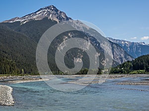 Snow capped mountains and river valley