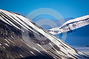 Snow capped mountains surround Longyearbyen, Norway