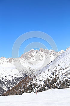 Snow-capped mountains in Trentino Alto Adige. Mountains in winter. Winter landscape in the Alps Mountains, Moena, Val di Fassa