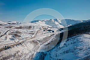 Snow-capped mountains under the bright sun