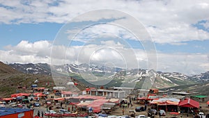 Snow-Capped Mountains and Urban Landscape