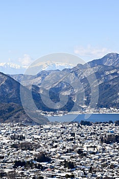 Snow capped Mt Mitsutouge beyond Lake Kawaguchiko