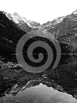 The Snow-capped Polish Tatras reflect a U upon Morskie Oko in Poland - Tatras