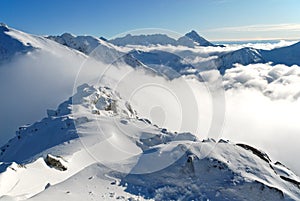 Snow capped summit of Tatry photo