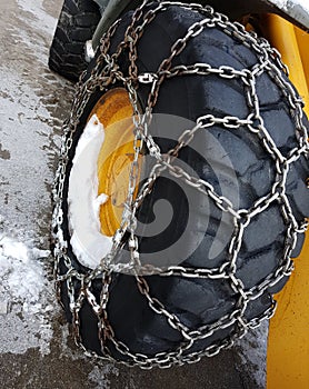 snow chain on the large wheel in winter