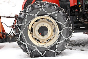 Snow chain on tractor tyre