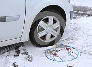 Snow chains in the car tyre in winter