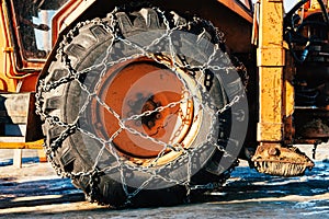 Snow chains on tractor tire