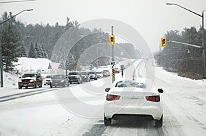 Snow in the city. Driving in severe weather conditions