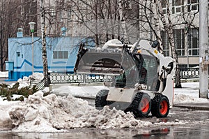 Snow cleaning machine on the streets of the city