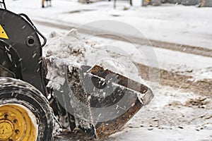 Snow cleaning machine work hard in city streets b