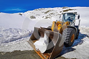 Snow clearing excavator in Aran Valley photo