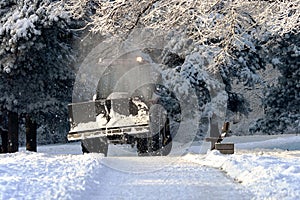 Snow clearing. Tractor clears the way after heavy snowfall in Riga