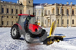 Snow combine harvests dirty snow on the road. Gatchina, Russia. snow removal, reportage shooting.