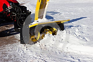 Snow combine harvests dirty snow on the road. Gatchina, Russia. snow removal, reportage shooting.