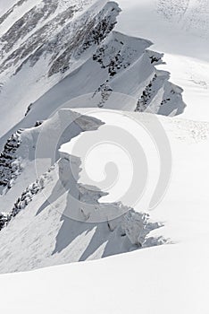 Snow Cornices in the Mountains