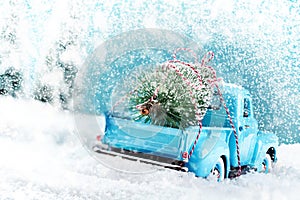 Snow countryside with christmas tree truck