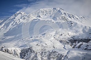 Snow covered 2928 meter high Piz Badus near city of Andermatt