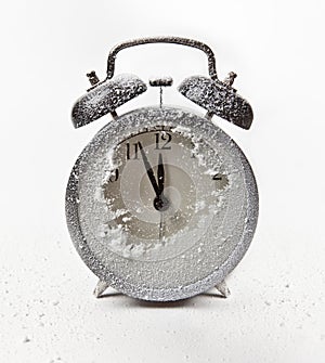 Snow-covered alarm clock.