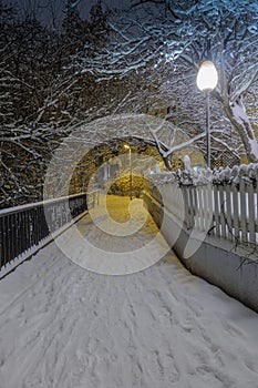 Snow-covered alleyway in the evening