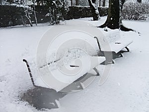 Snow covered bench