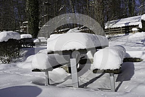 Snow Covered Bench And Table