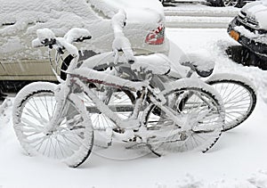 Snow covered bicycles after snowstorm, New York City