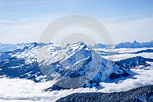 snow covered blue mountain layers of the swiss alps. switzerland alpine snowy mountains on a sunny day, blue sky.