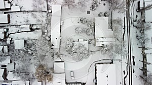 snow-covered buildings top view 4k